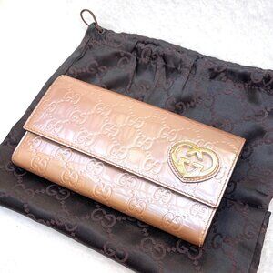 Gucci Guccisma pearlized GG Patent Leather Bifold Long Wallet in Rose beige